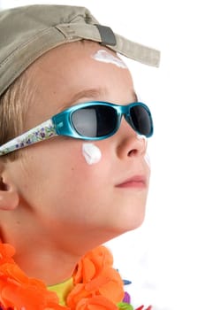 Cute summer holiday picture of a boy with hat and sunglasses.