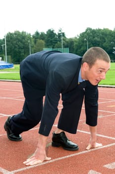 Businessman is ready for the start of his run.