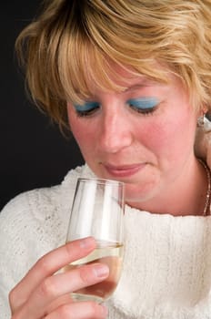 Woman toasting on a new year. Against a black background.