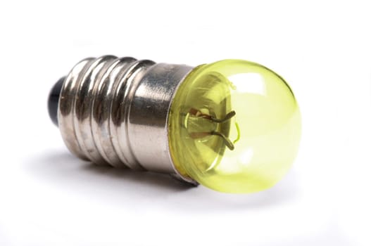 Macro image of a small light bulb giving light.
