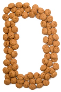 Little ginger nuts in the form of the letter D. These little ginger nuts are used in Holland for the "Sinterklaas"" party, which is at Dec 5 every year. Sinterklaas is a sort of Santa Claus. In Holland these ginger nuts are called ""pepernoot"". Isolated on white."