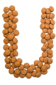 Little ginger nuts in the form of the letter U. These little ginger nuts are used in Holland for the "Sinterklaas"" party, which is at Dec 5 every year. Sinterklaas is a sort of Santa Claus. In Holland these ginger nuts are called ""pepernoot"". Isolated on white."