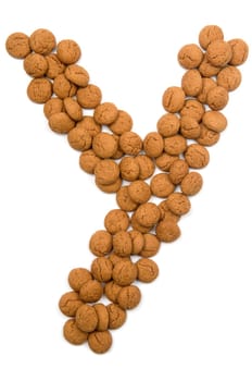 Little ginger nuts in the form of the letter Y. These little ginger nuts are used in Holland for the "Sinterklaas"" party, which is at Dec 5 every year. Sinterklaas is a sort of Santa Claus. In Holland these ginger nuts are called ""pepernoot"". Isolated on white."