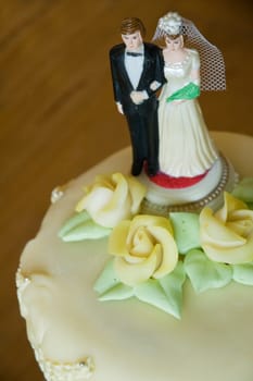 Traditional bride and groom figures on a wedding cake