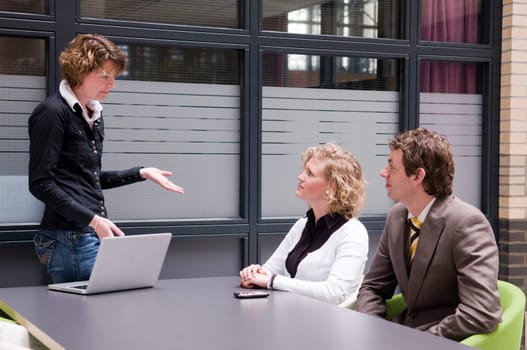Businesswoman giving a workshop with her colleagues