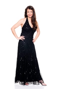 Studio shot of a middle-aged woman in an evening gown against a white background