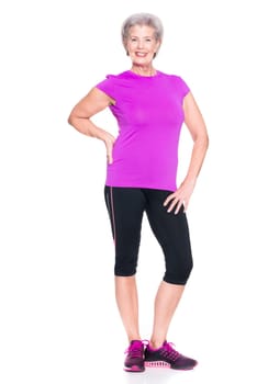 Studio recording of an active senior woman playing sports against a white background