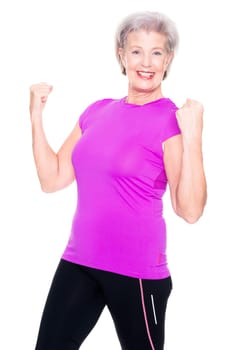 Studio recording of an active senior woman playing sports against a white background