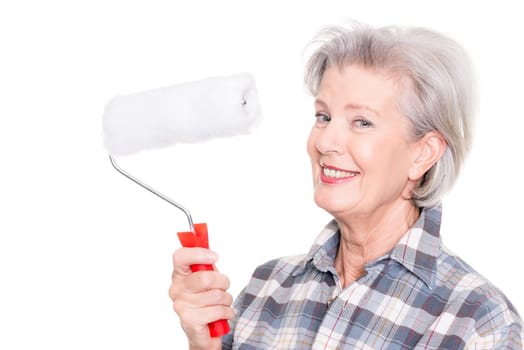 Studio shot of an elderly woman with a painter's role against a white background