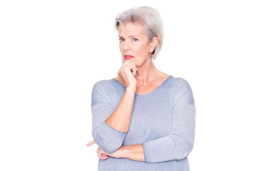 Astonished elderly woman in front of white studio background