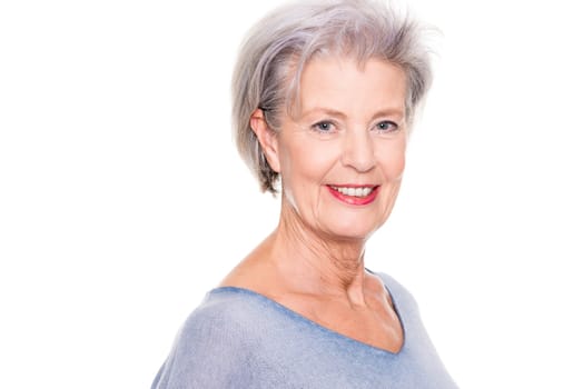 Studio recording of an active and happy senior against a white background