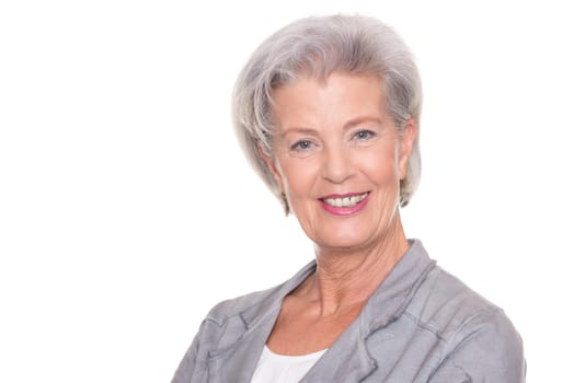 Studio recording of a smiling senior woman against a white background
