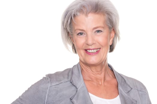 Studio recording of a smiling senior woman against a white background