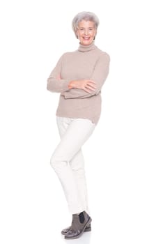 Studio recording of an active and happy senior against a white background