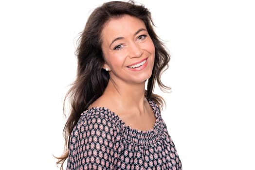Smiling middle-aged woman against a white background
