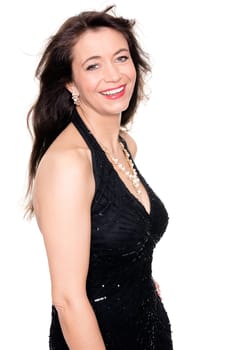 Studio recording of a middle-aged woman in an evening dress against a white background