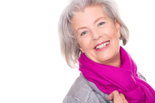 Studio recording of a smiling senior woman against a white background