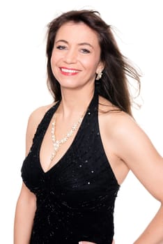 Studio shot of a middle-aged woman in an evening gown against a white background