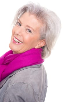 Studio recording of a smiling senior woman against a white background