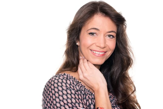 Smiling middle-aged woman against a white background