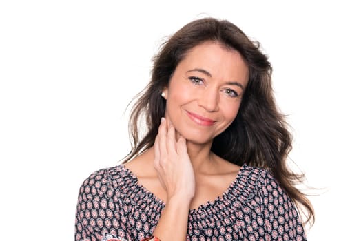 Smiling middle-aged woman against a white background