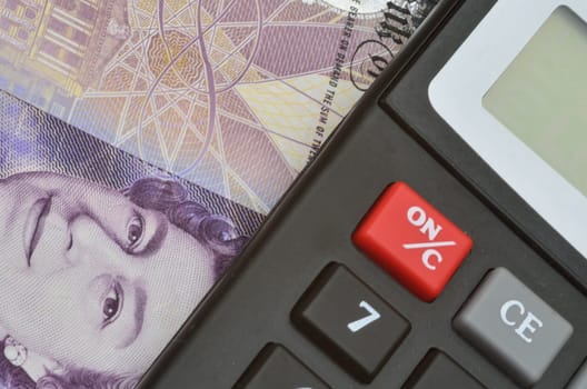 Detail of banknote and calculator