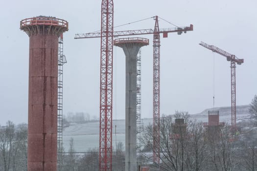 Bridge construction site,bridge under construction seen from below during snow drifts. .