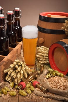 old beer carrier with beer glass,wheat,barley,hops and malt