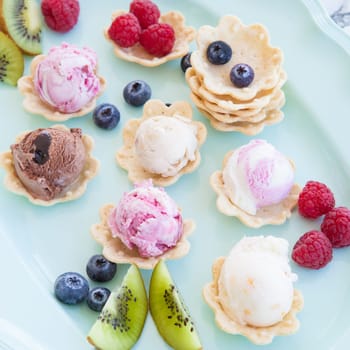 Various balls of ice cream in small bowls