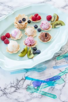 Various balls of ice cream in small bowls
