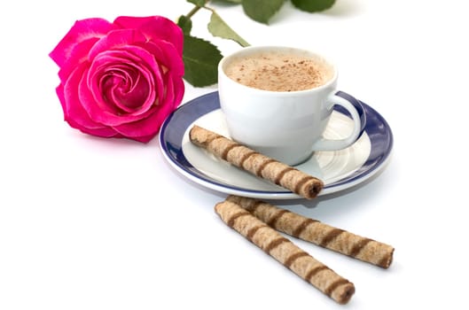 rose and cappuccino on a saucer with a blue border