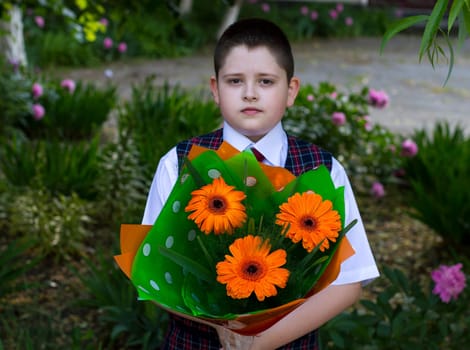 the school student with a beautiful bouquet of flowers, the front view