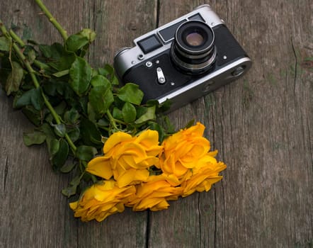 bouquet of yellow roses and retro the camera on a table