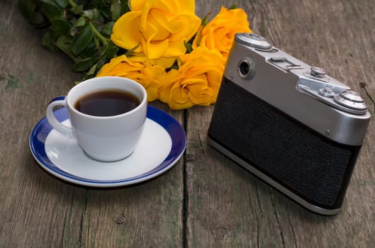 still life on a retro, the camera, roses and coffee
