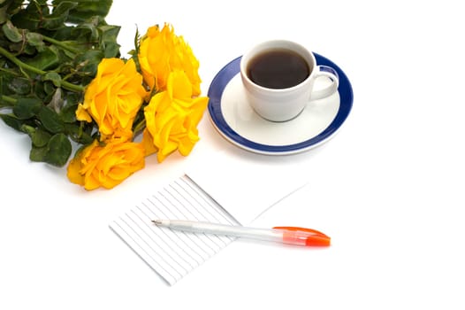 cup of coffee, bouquet of yellow roses and notebook with the handle, the isolated image
