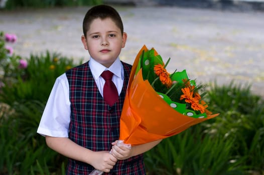 the lovely school student with a beautiful bouquet of flowers
