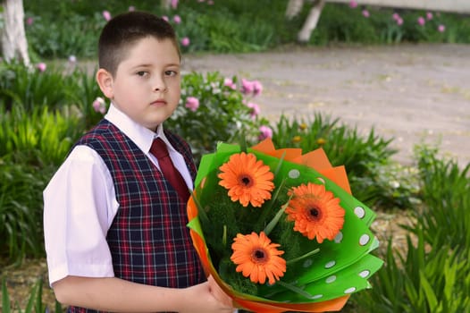 On September 1 the school student with a beautiful bouquet of flowers