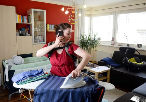Mother with baby and smartphone