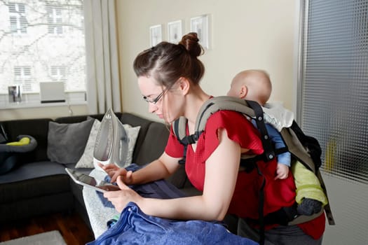 Mother with baby and digital tablet