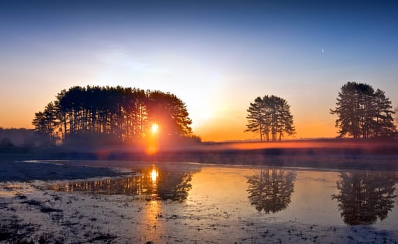 Sunrise over the lake, spring landscape