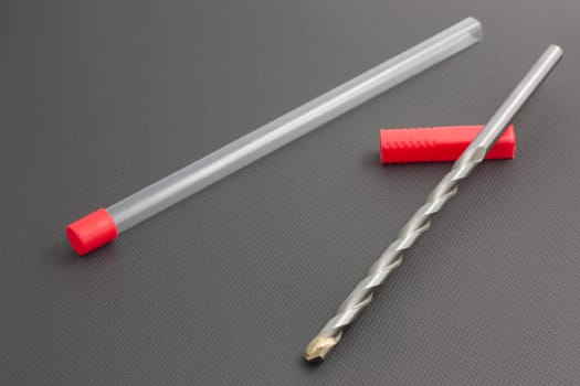 Drill for concrete with case isolated on a black background