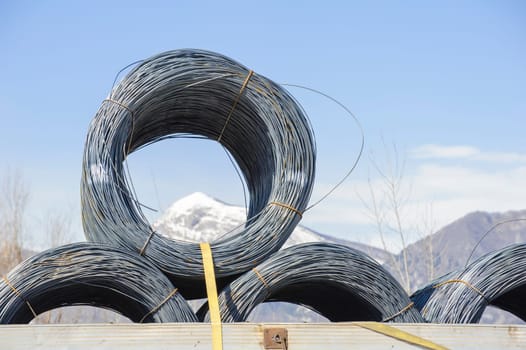 Steel Wire Rolls. Steel wire rolls industrial construction products on transport trailer.