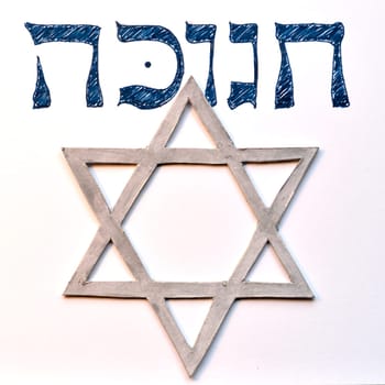Hebrew word "hanukkah"" or ""chanukah"". Jewish holiday, festival of lights. With Star of David."