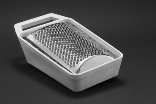 The mini grater on black background
