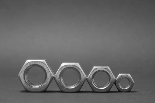 close up of four nuts isolated on gray background