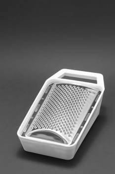 The mini grater on black background