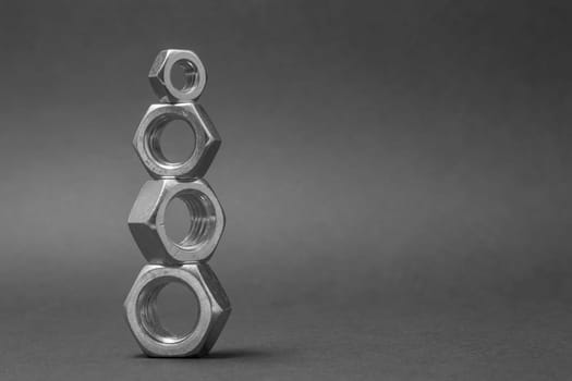 close up of four nuts isolated on gray background