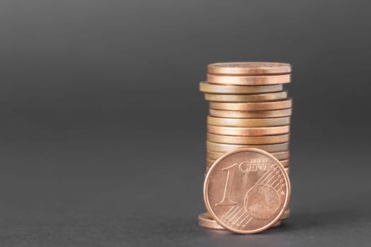 One cents of euro isolated on a dark background to understand a business concept