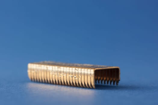 Charging points for nail gun isolated on blue background