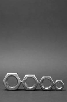 close up of four nuts isolated on gray background